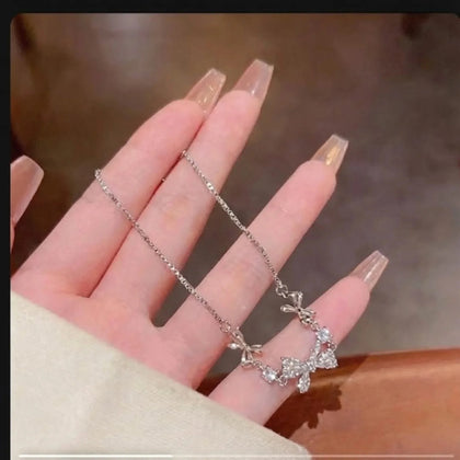 Crystal Bow Charm Necklace hover